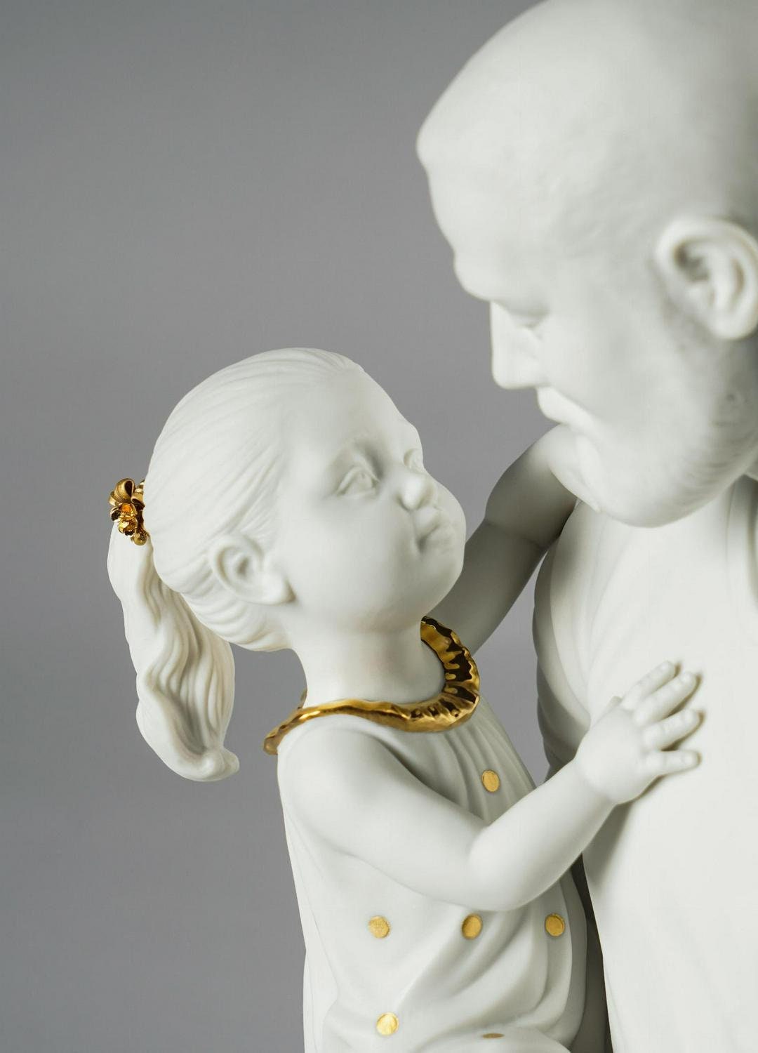 In daddy's arms figurine. golden luster and white porcelain sculpture by lladro home decor birthday gift